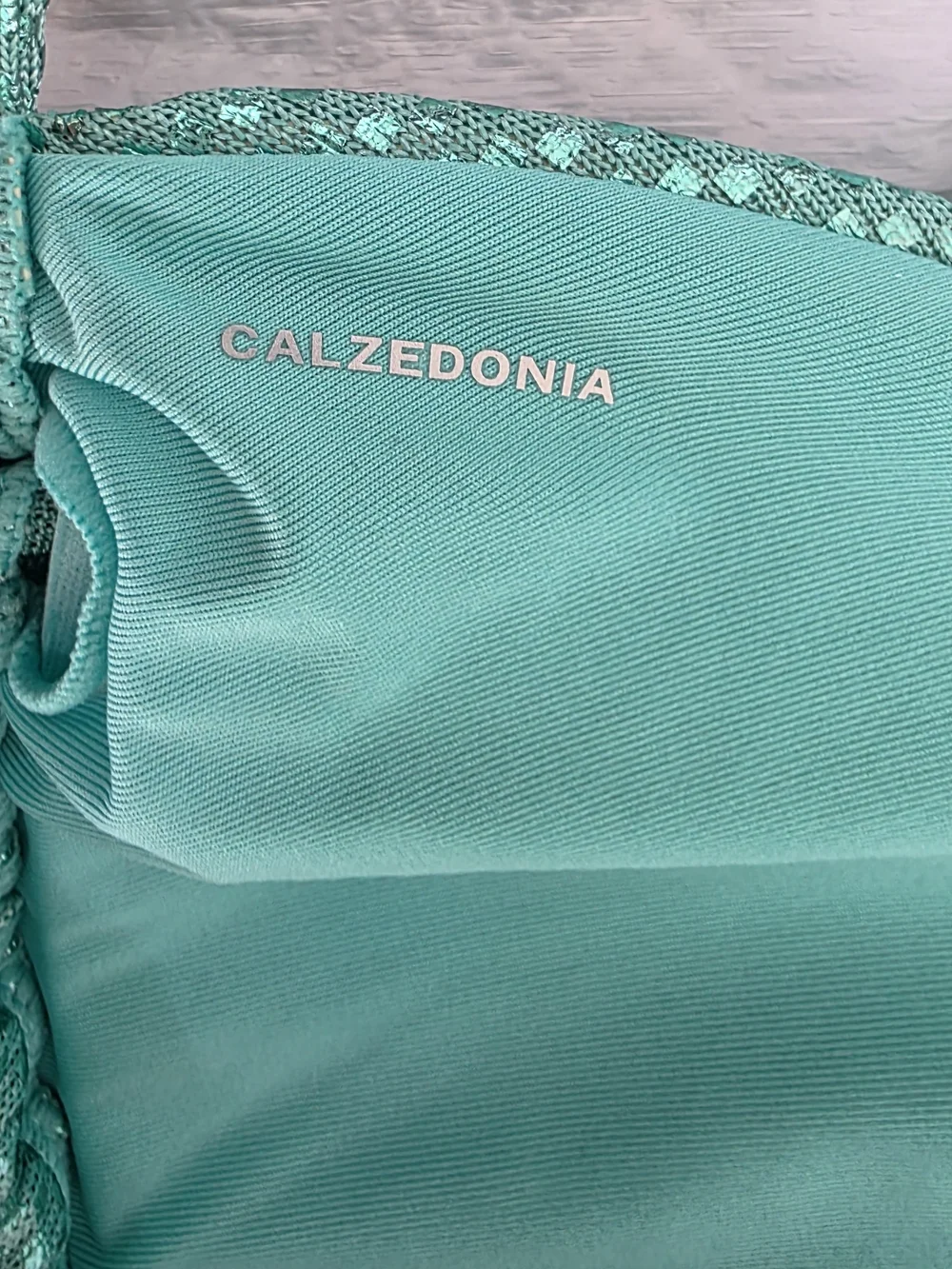 Calzedonia teal triangle